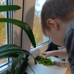 Помогал маме убираться дома.